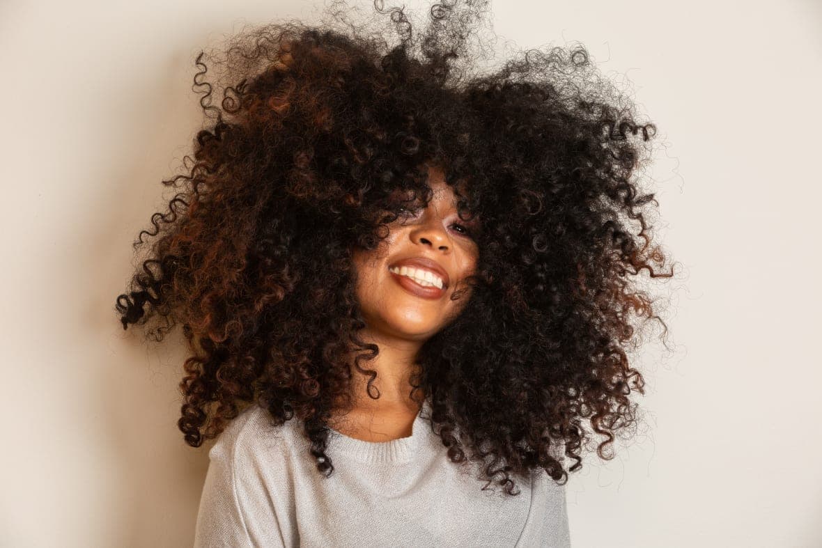 A woman with an Afro hairstyle