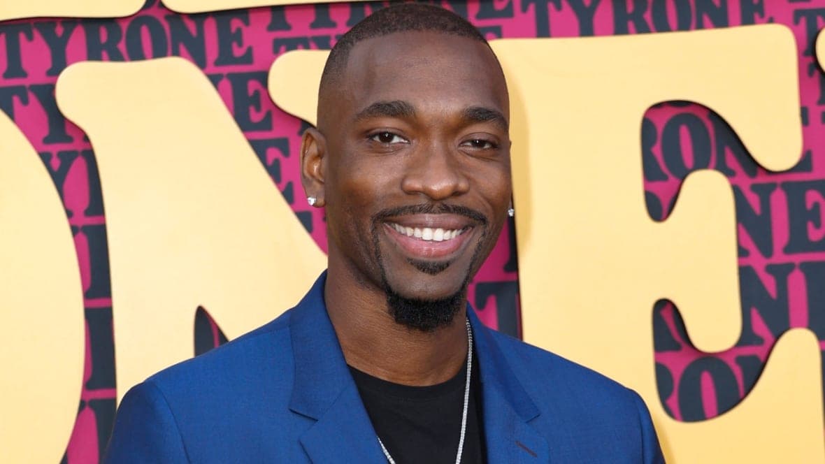 Comedian Jay Pharoah wearing a blue jacket and black shirt