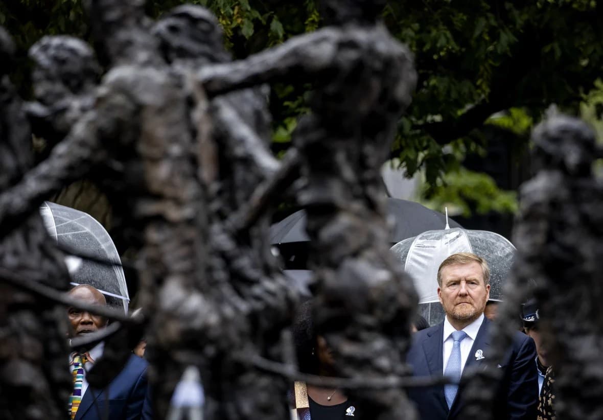 Dutch King Willem-Alexander lays a wreath at the slavery monument