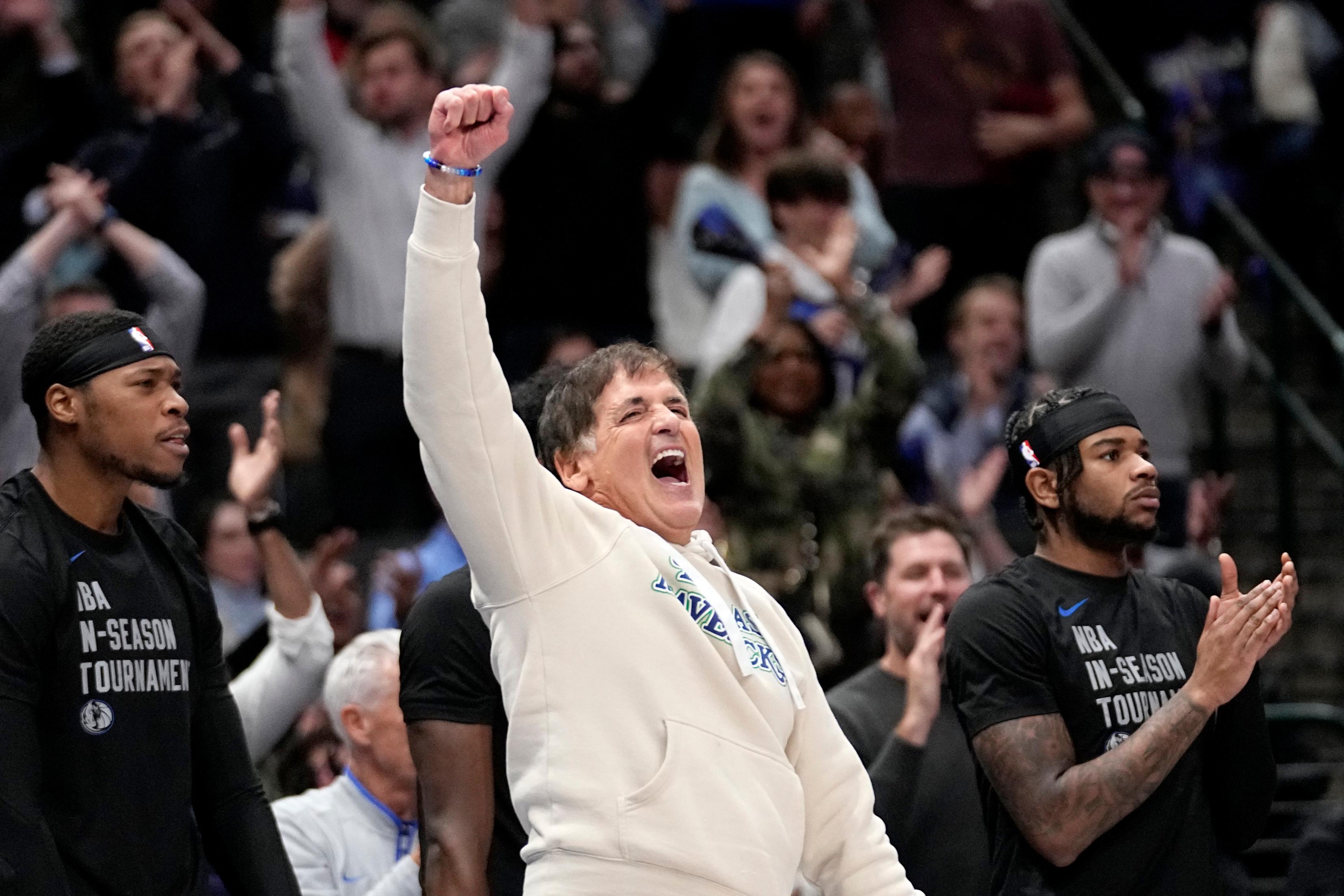 Dallas Mavericks team owner Mark Cuban celebrates