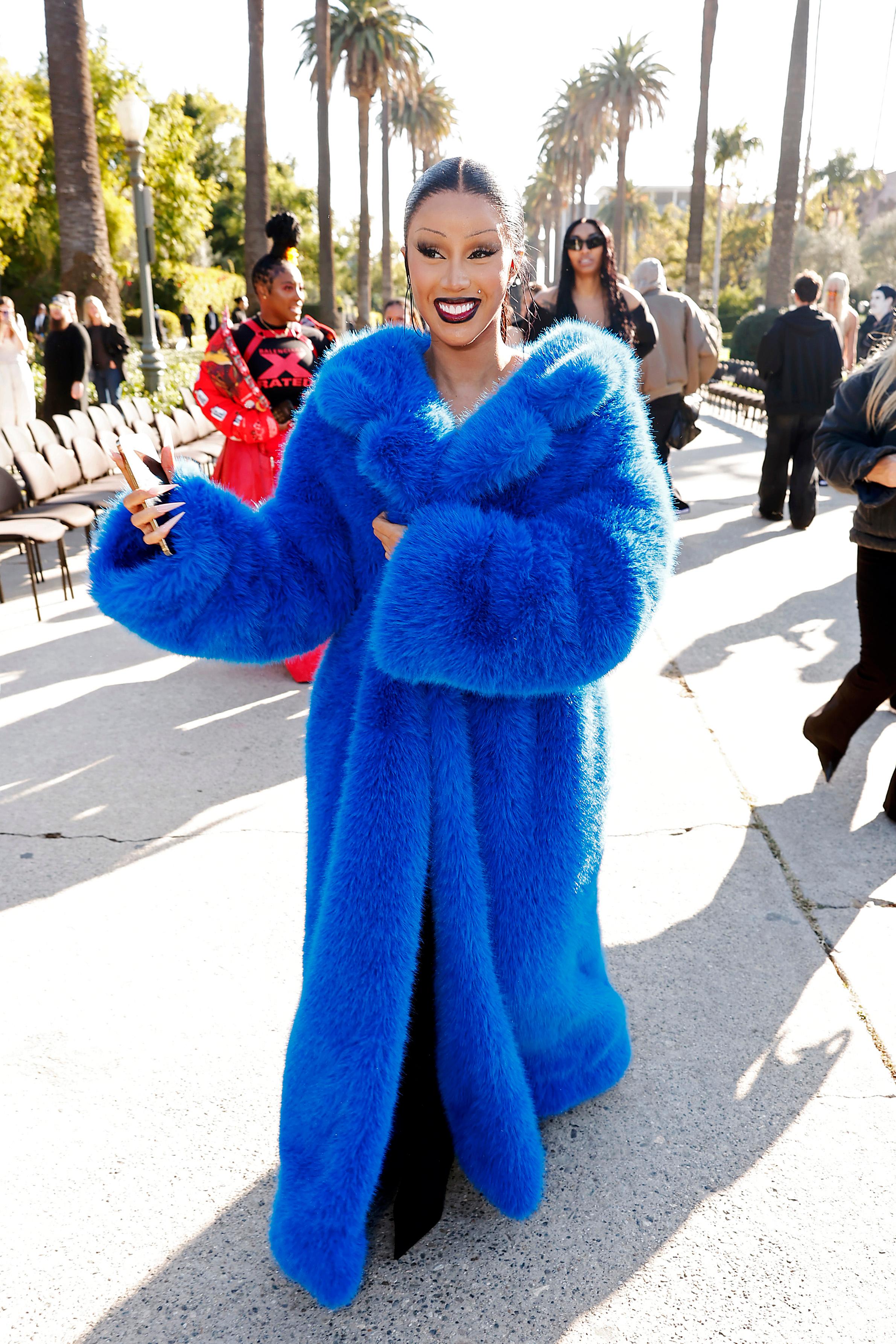 Rapper Cardi B in a full-length blue fur coat