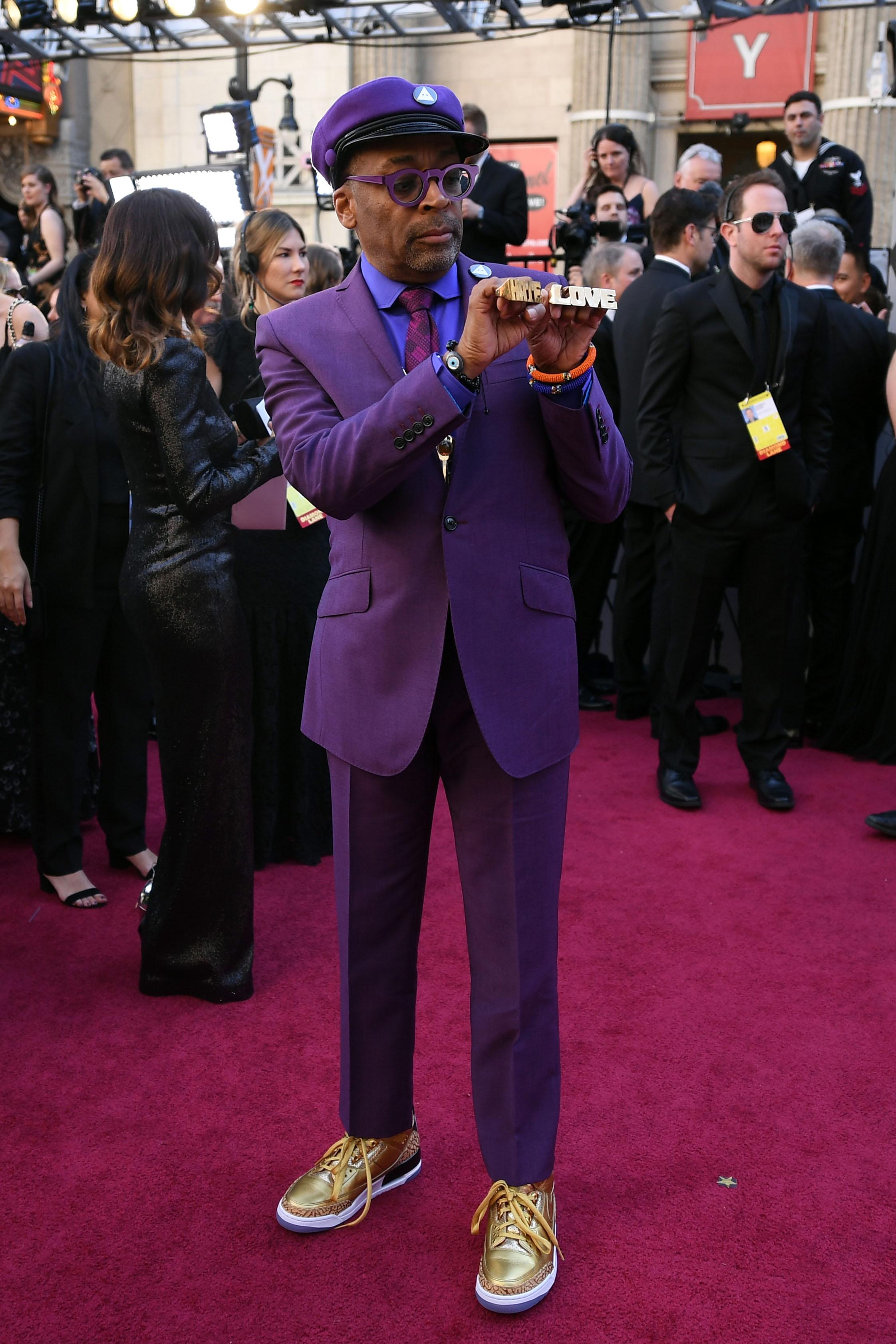Filmmaker Spike Lee, wearing gold Nike Air Jordan 3s