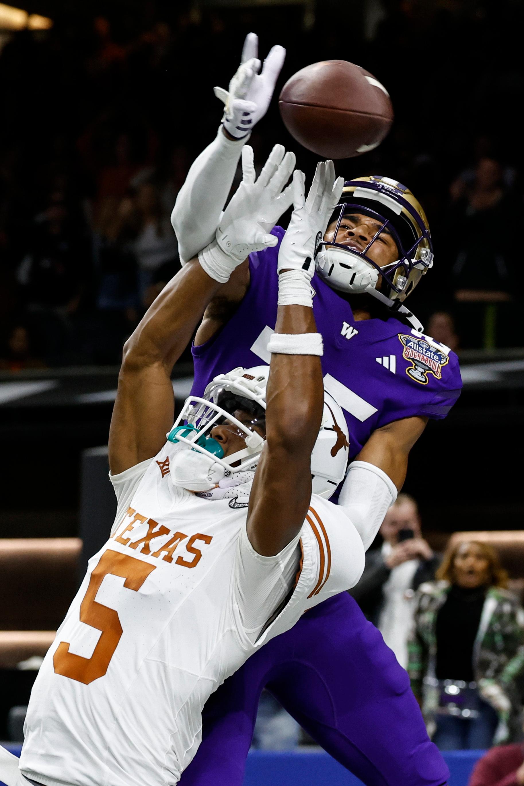 Washington cornerback Elijah Jackson and Texas wide receiver Adonai Mitchell