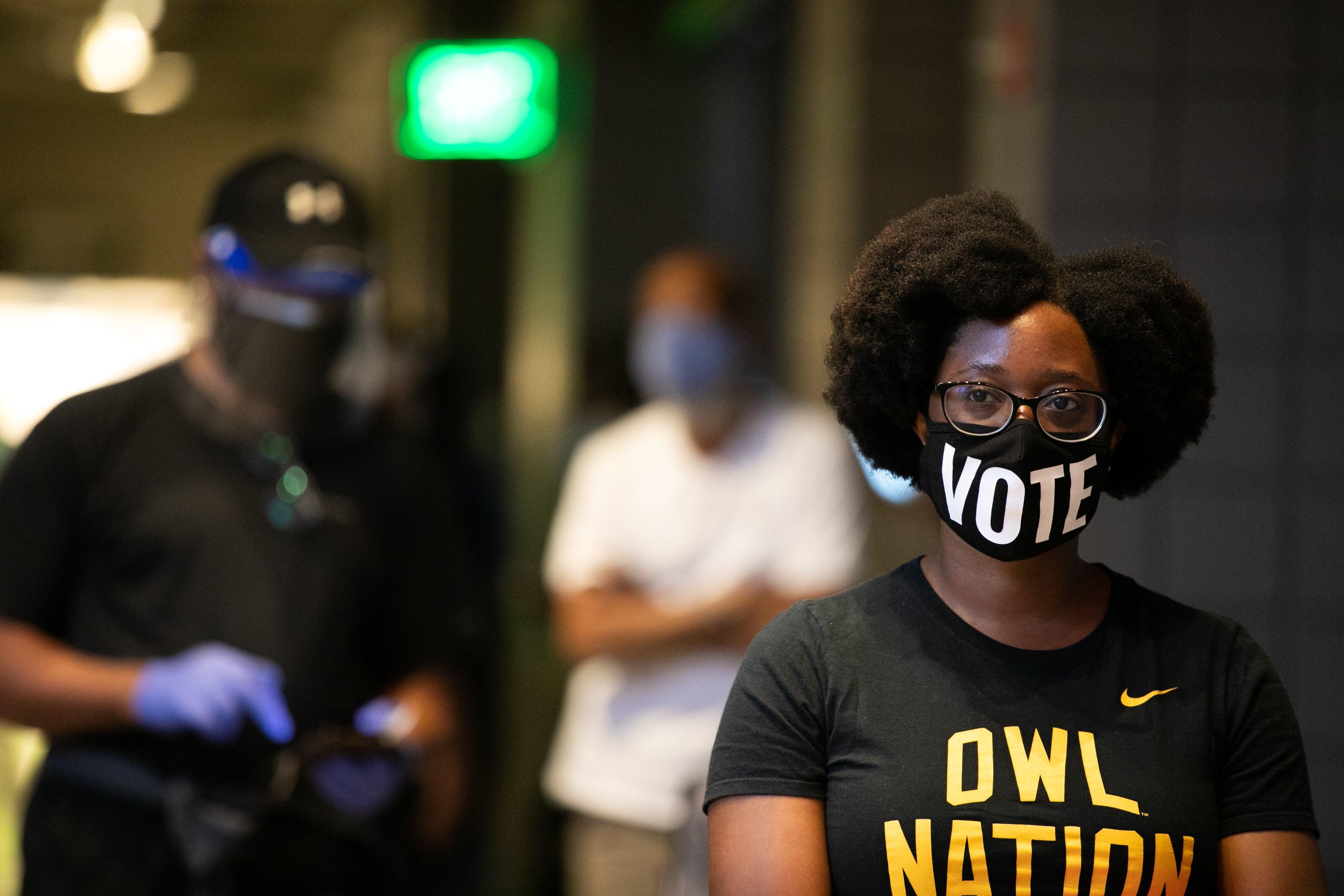 Ashley Nealy waits in line to vote