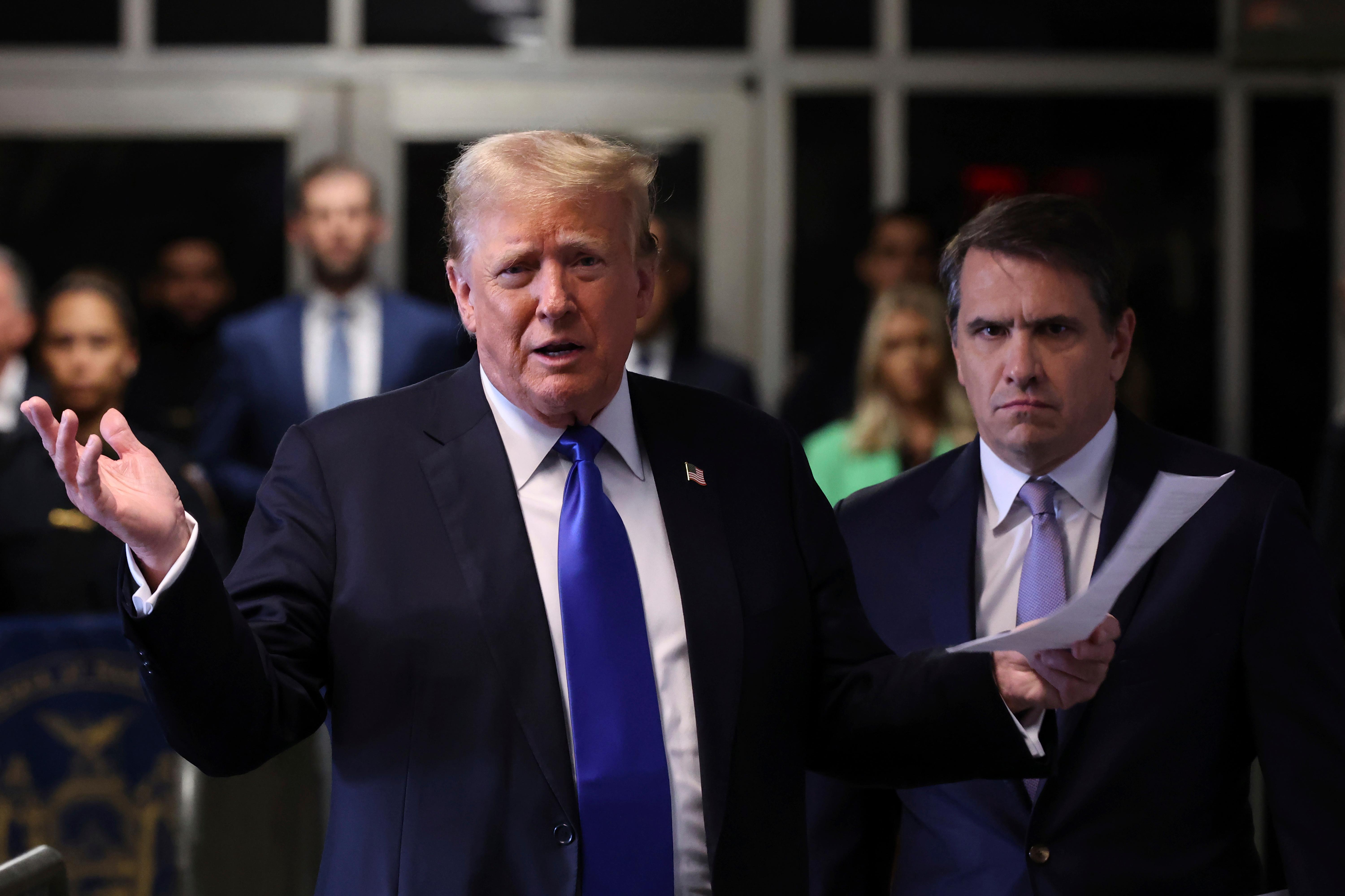 Former President Donald Trump speaks to the media outside Manhattan criminal court