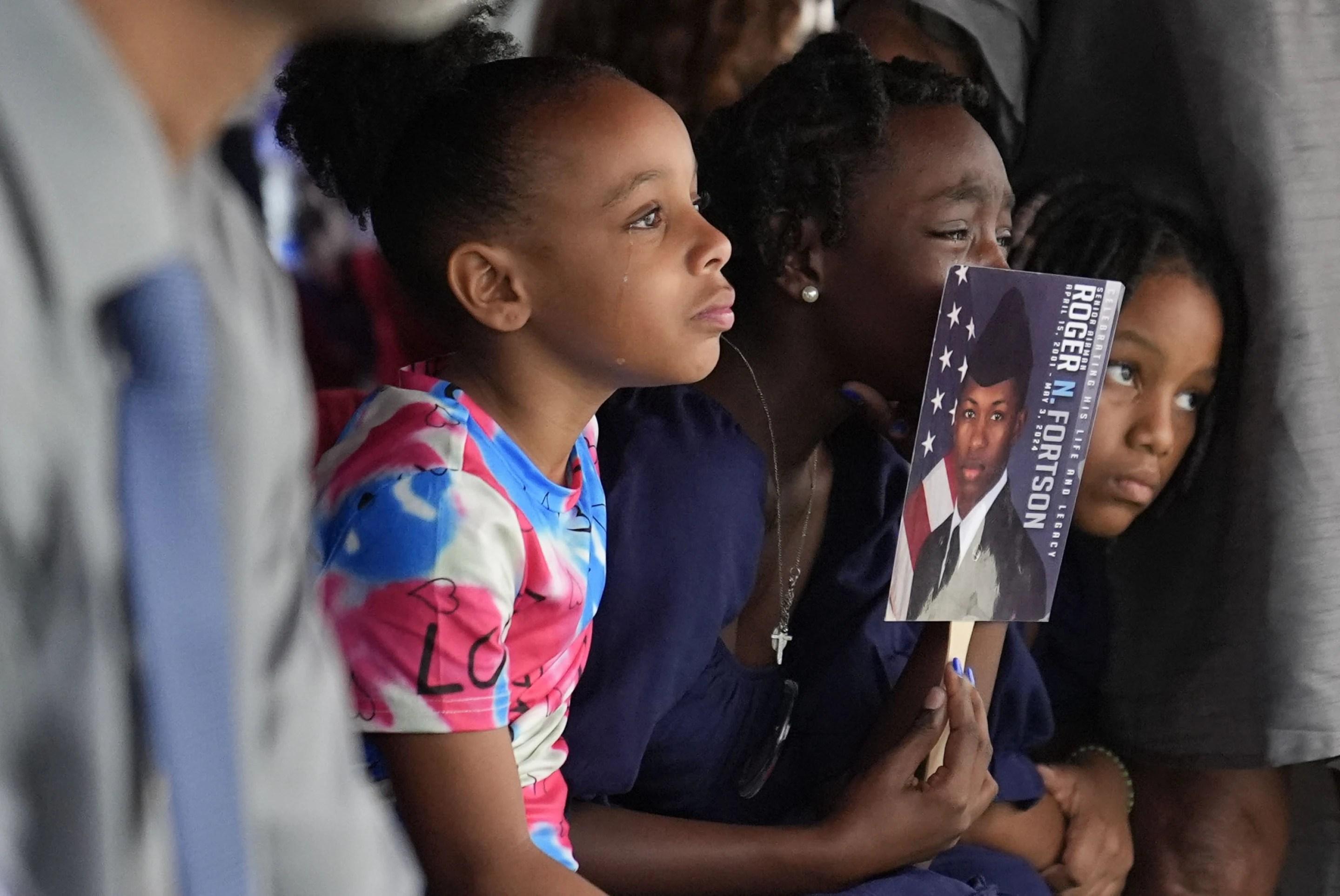 Family members cry for slain airman Roger Fortson