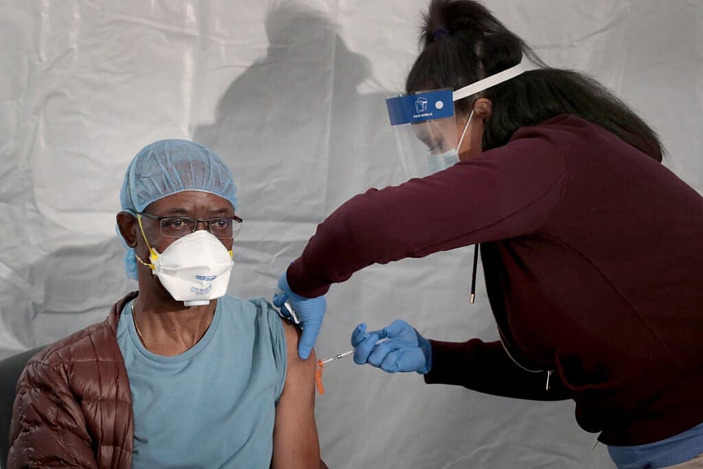 COVID vaccine thegrio.com