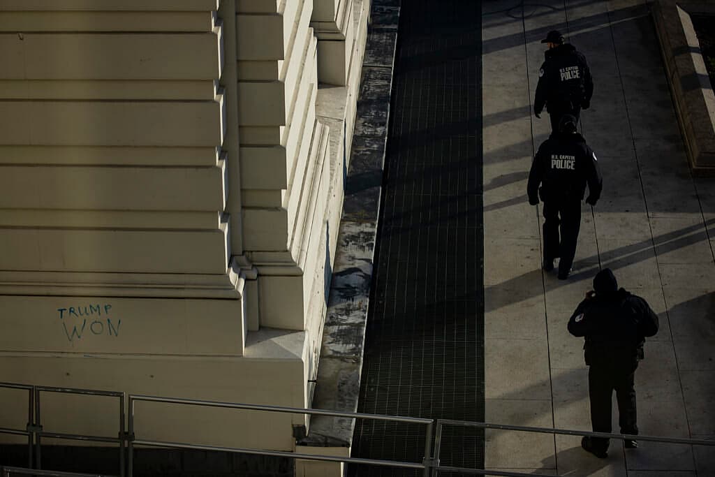 Capitol Police officers sweep the grounds of the U.S. Capitol building on January 7, 2021