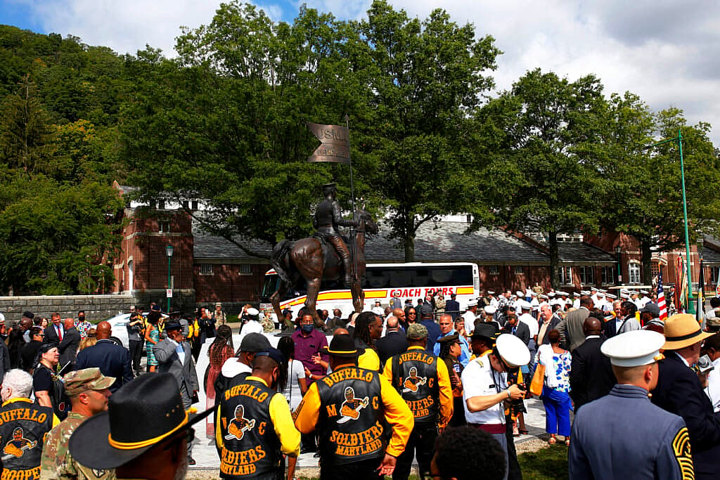 People attend a dedication of a statue honoring Buffalo Soldiers at Buffalo Soldier Field in West Point Military Academy