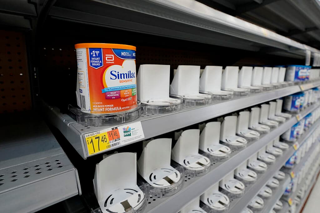 Shelves typically stocked with baby formula sit mostly empty at a store