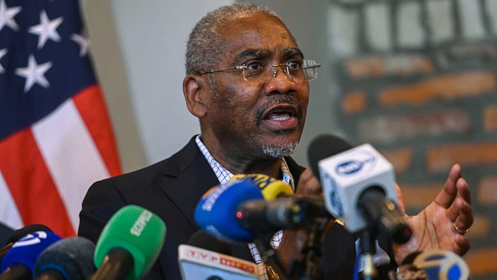 Gregory Meeks, chairman of the House Foreign Affairs Committee, in front of a group of microphones