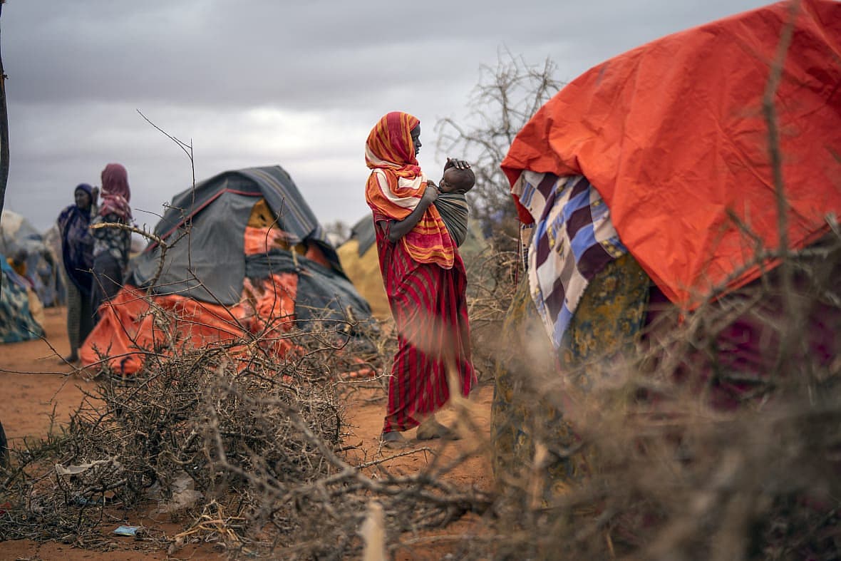 A Somali woman breastfeeds her child