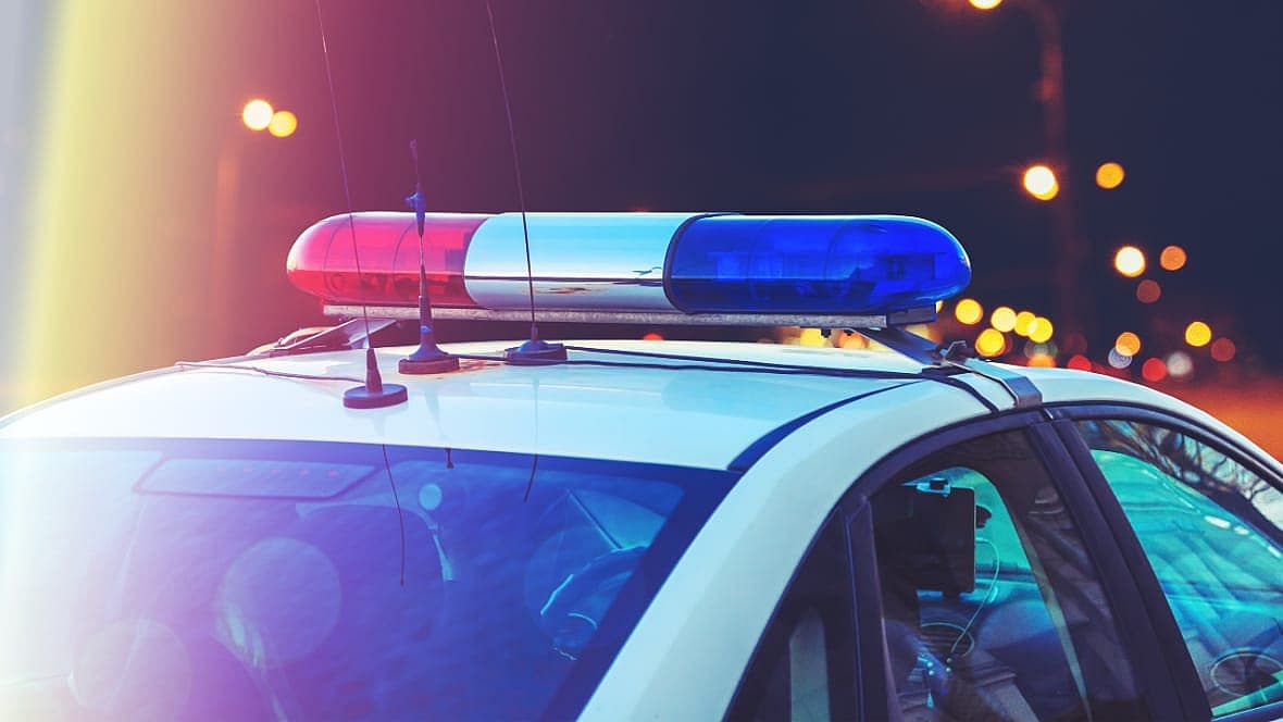 Red and blue lights on top of a police car