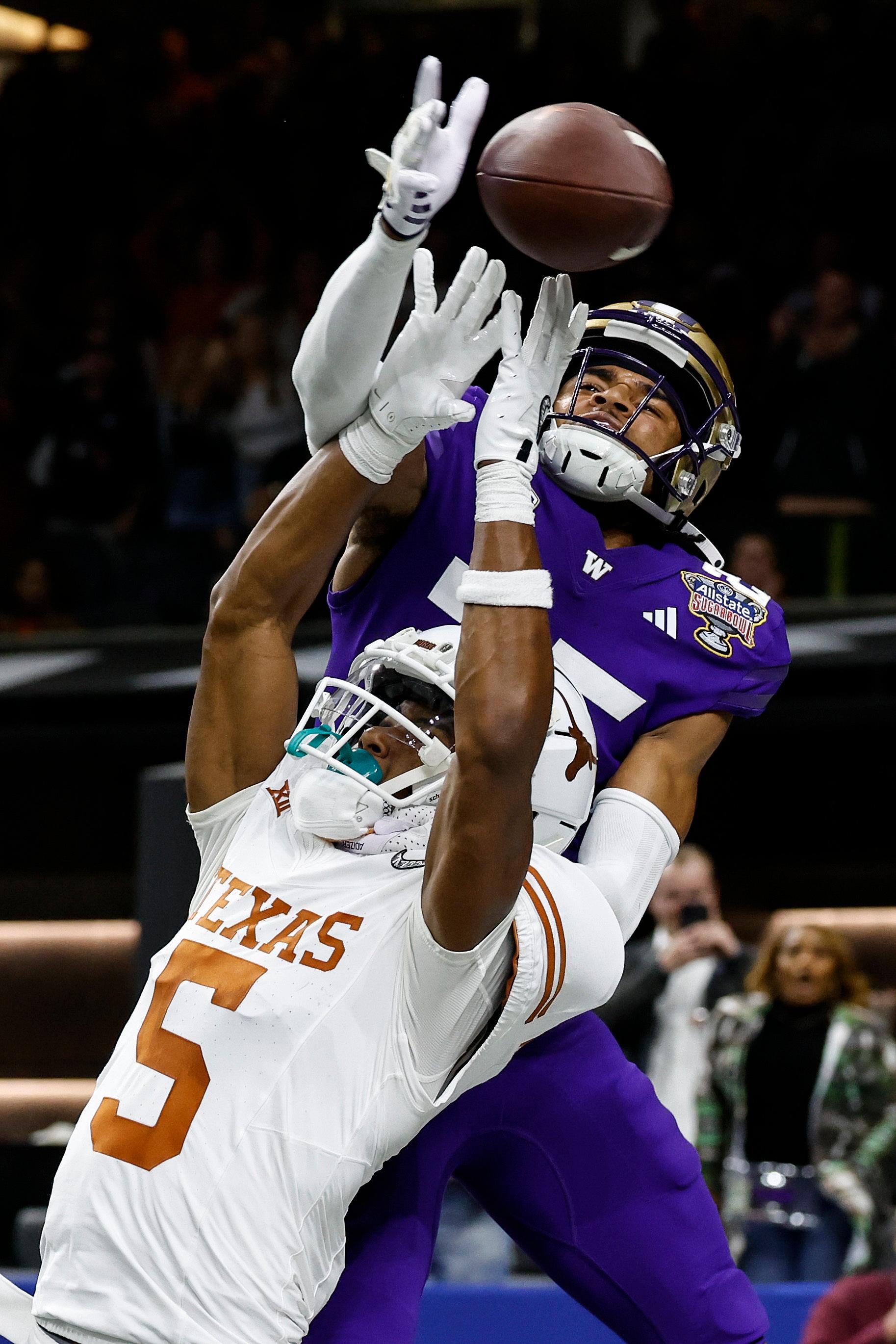 Washington cornerback Elijah Jackson and Texas wide receiver Adonai Mitchell