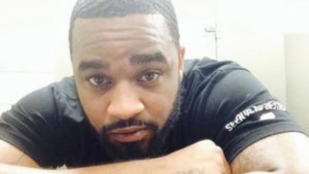 Dominic “DJ” Broadus II is shown wearing a black shirt