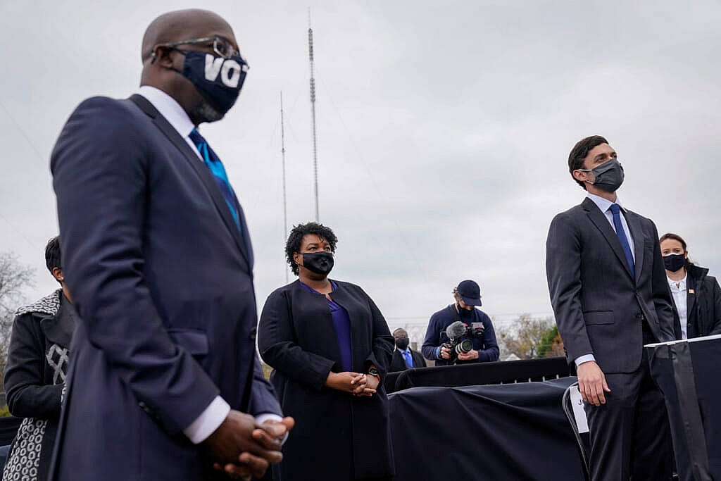 The Reverend Raphael Warnock and politician Stacey Abrams