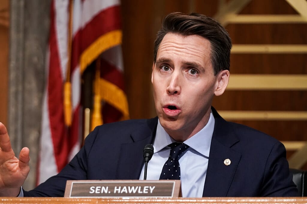 Missouri Senator Josh Hawley wearing a blue jacket and blue dotted tie