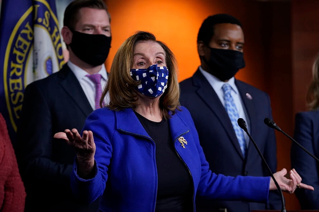 House Speaker Nancy Pelosi of Calif., with impeachment managers Reps. Eric Swalwell, D-Calif., and Joe Neguse, D-Colo.