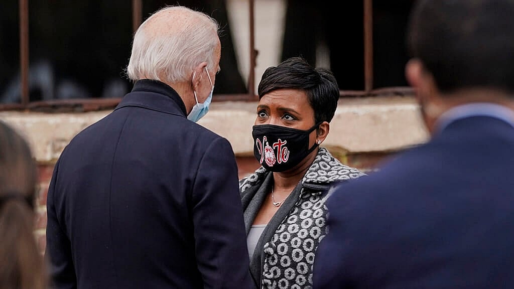 President Joe Biden talks with Atlanta Mayor Keisha Lance Bottoms