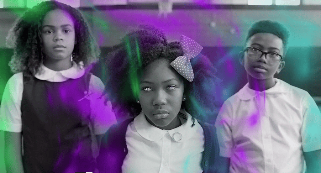 Three children in a scene from "Little Apple"