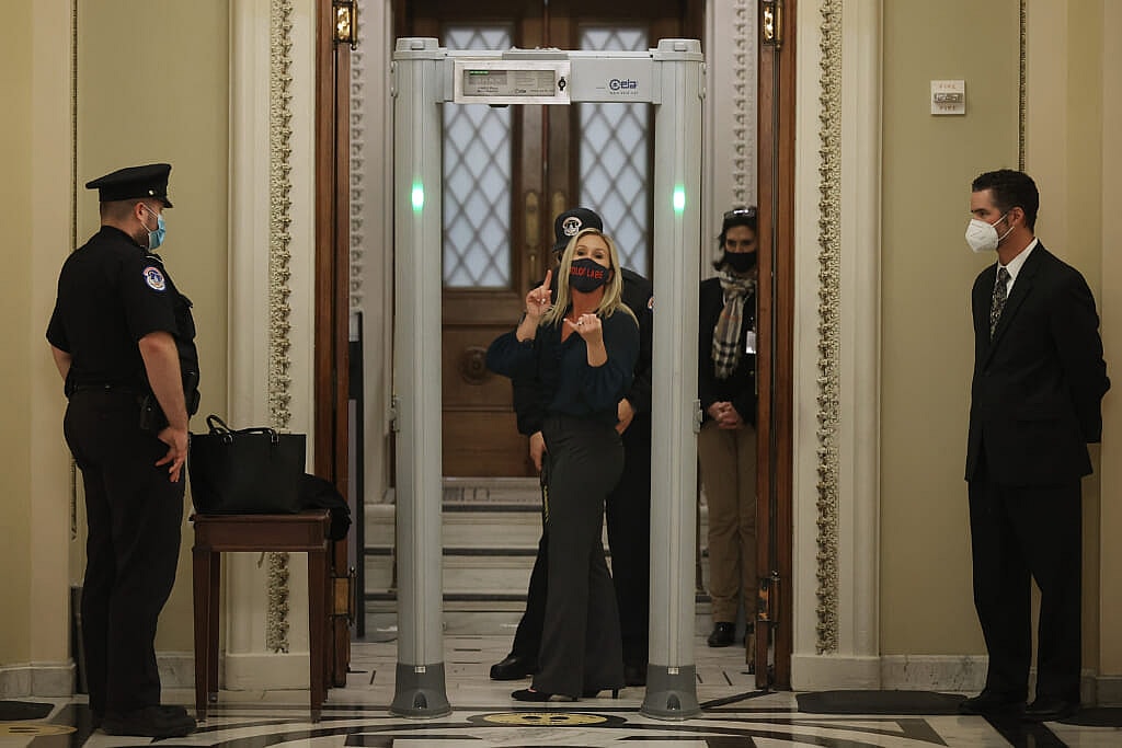 Rep. Marjorie Taylor Greene (R-GA) sets off the metal detector outside the doors to the House of Representatives Chamber