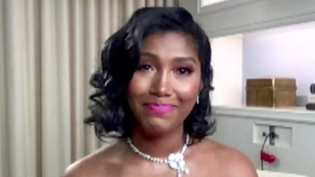 Taylor Simone Ledward Boseman, widow of late actor Chadwick Boseman, wears a white flower necklace