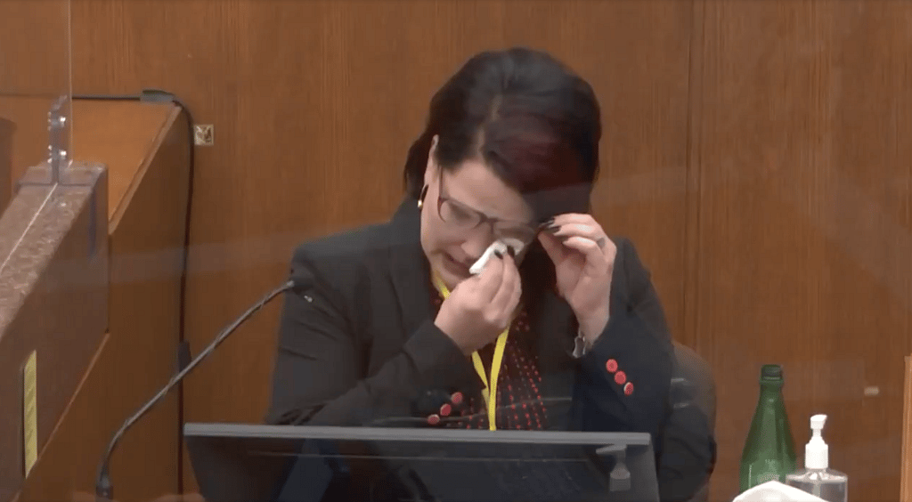 Courteney Ross, George Floyd's girlfriend, wipes her eyes on the witness stand
