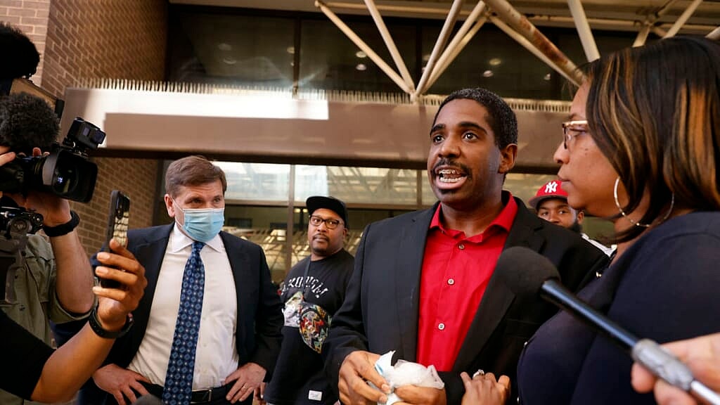 Defense attorney Toby Shook, former Dallas police officer Bryan Riser and his wife, Eboni Samuel Riser