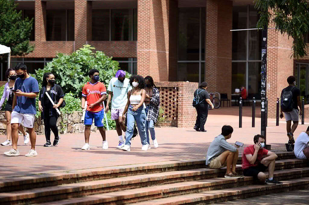 Students walk through the campus of the University of North Carolina at Chapel Hill