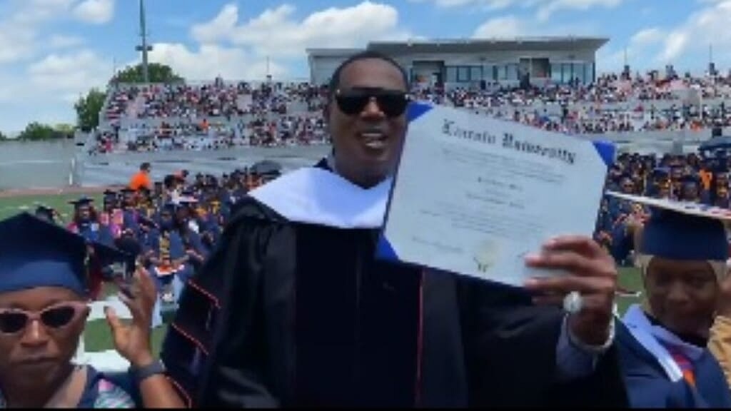 Hip-hop icon and business mogul Percy “Master P” Miller holds up his honorary doctorate from Lincoln University