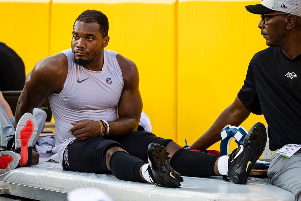 J.K. Dobbins of the Baltimore Ravens is carted off the sidelines after being injured