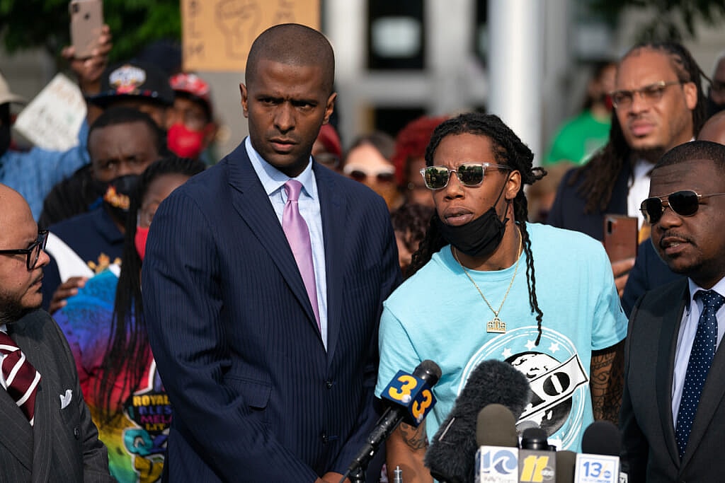 Bakari Sellers with Khalil Ferebee (C), the son of Andrew Brown Jr.