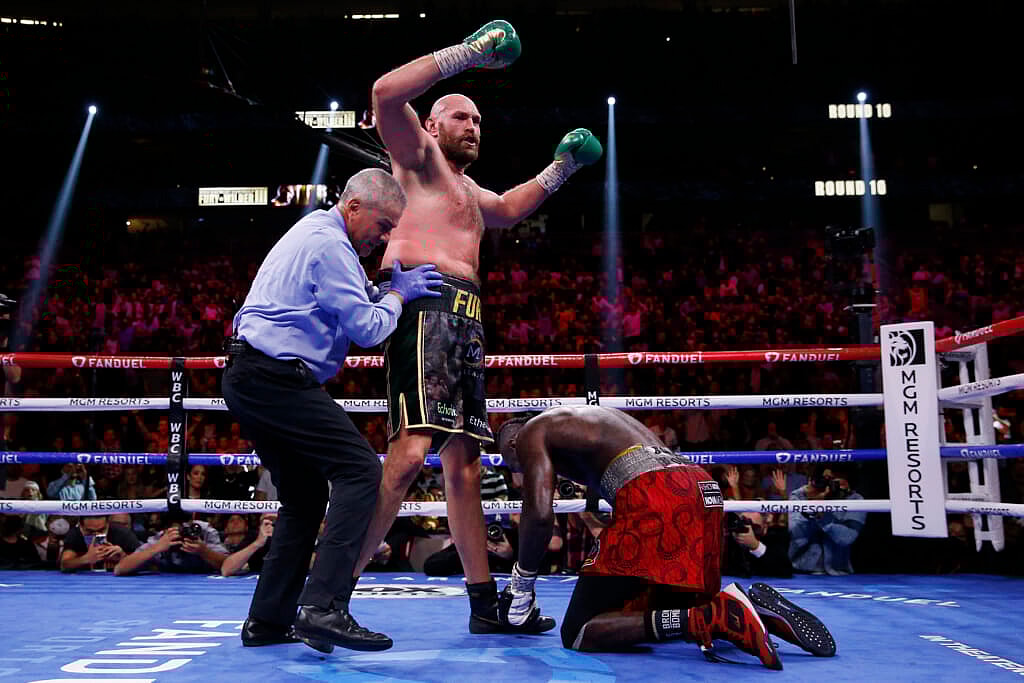 Tyson Fury, of England, knocks down Deontay Wilder
