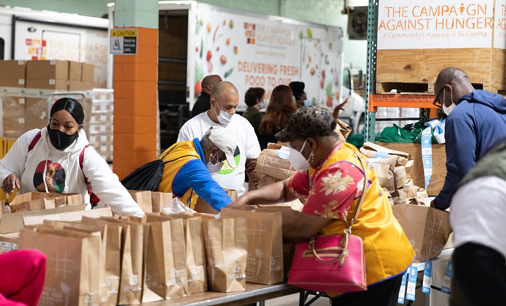 Volunteers packing donated food