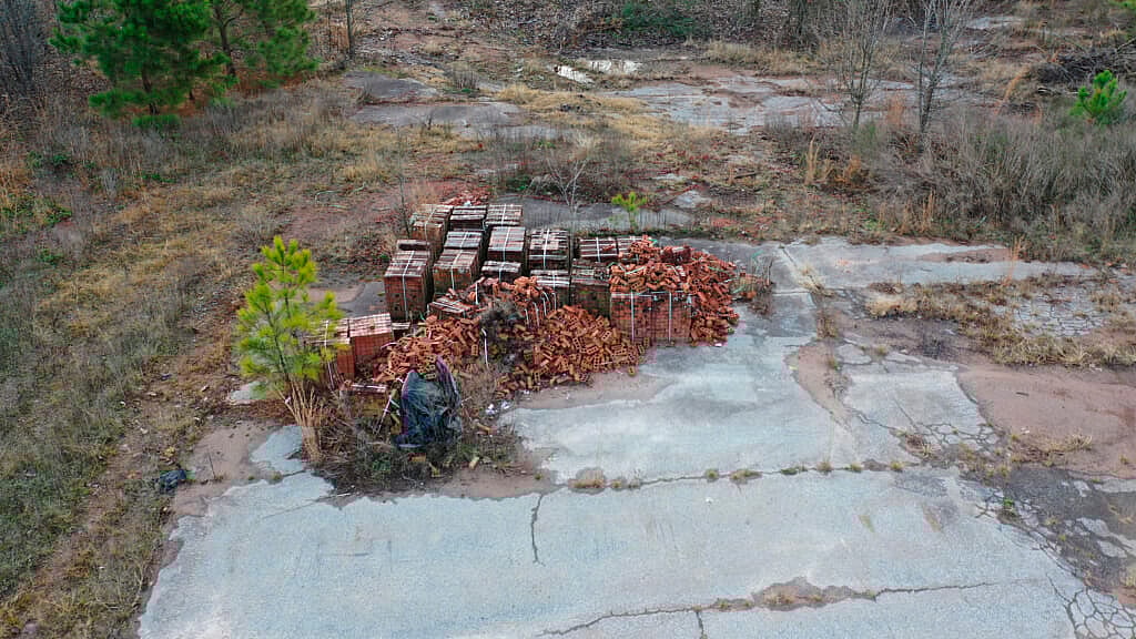 A pile of bricks lies on the site of the Chattahoochee Brick Company