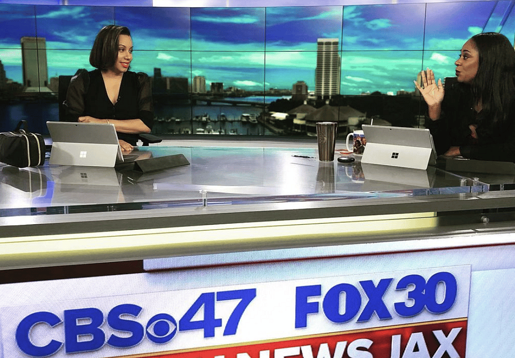 News anchor Letisha Bereola and another woman at a new desk
