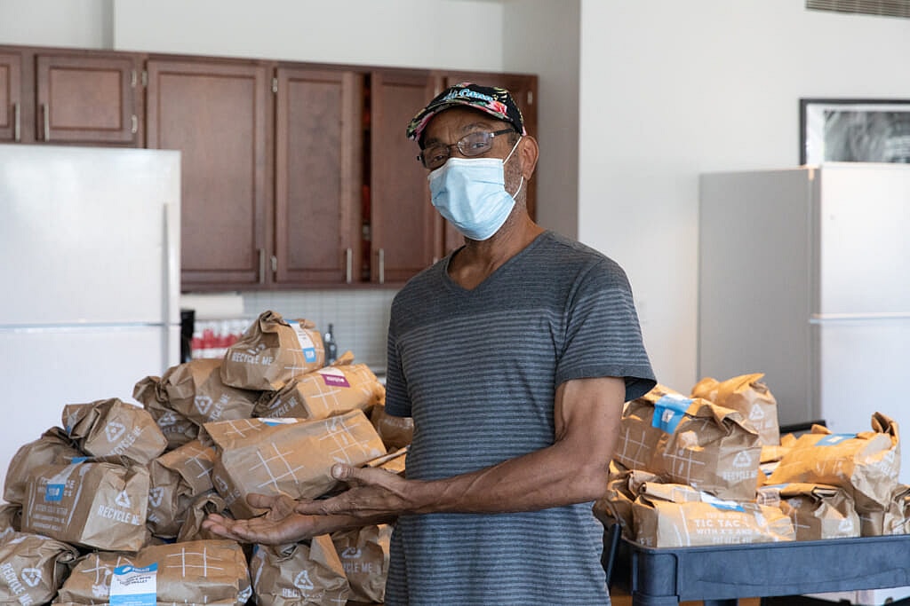 Military veteran George Wolfe receives donated food