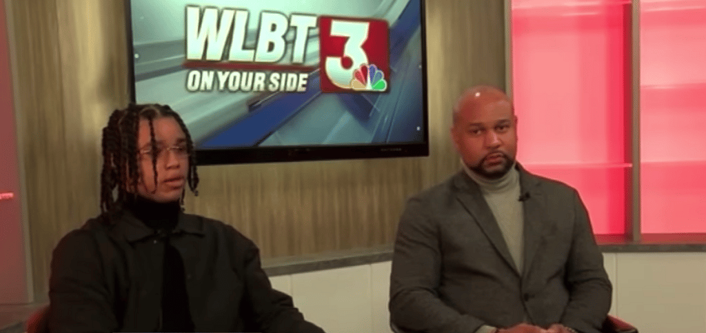 Demonterrio Gibson and his attorney, Carlos Moore, in a television station