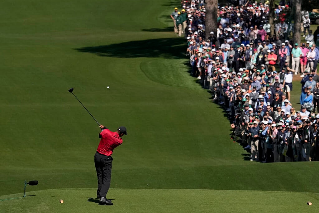 Golfer Tiger Woods hits his tee shot