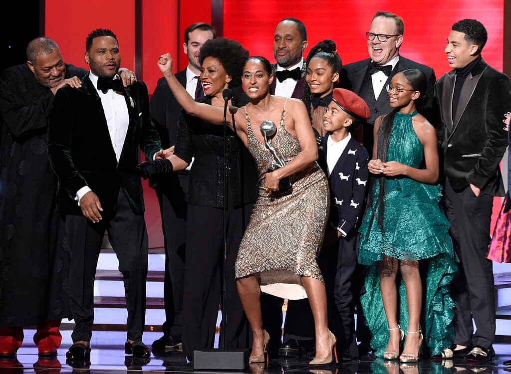 The cast and crew of “black-ish” accepts the award for outstanding comedy series