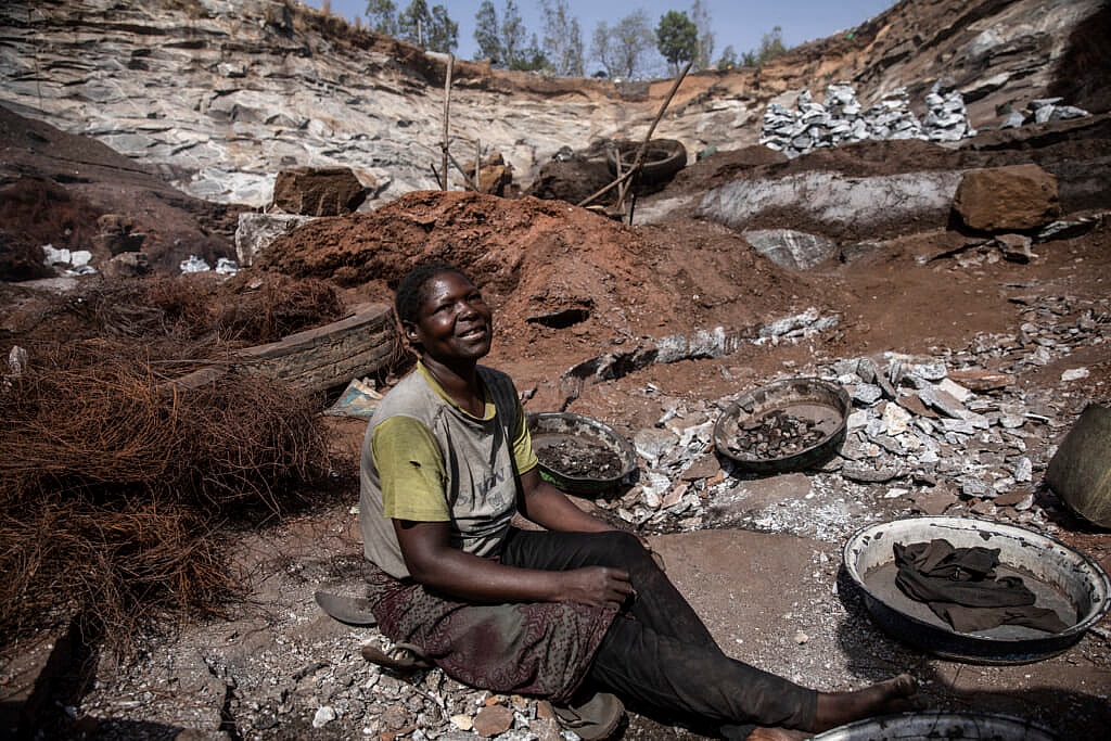 Ami Sana sits in the Pissy granite mine where she works