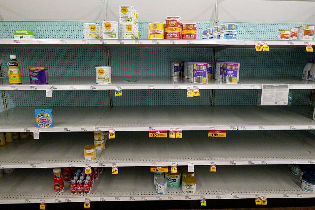 Baby formula is displayed on the shelves of a grocery store