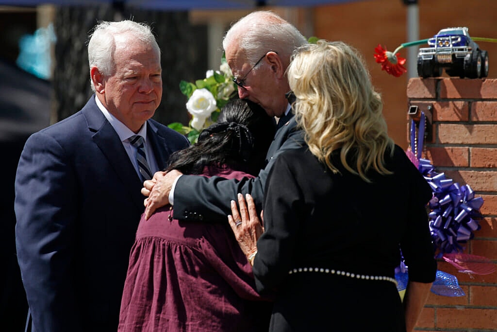 President Joe Biden and First Lady Jill Biden comfort Principal Mandy Gutierrez by Superintendent Hal Harrell