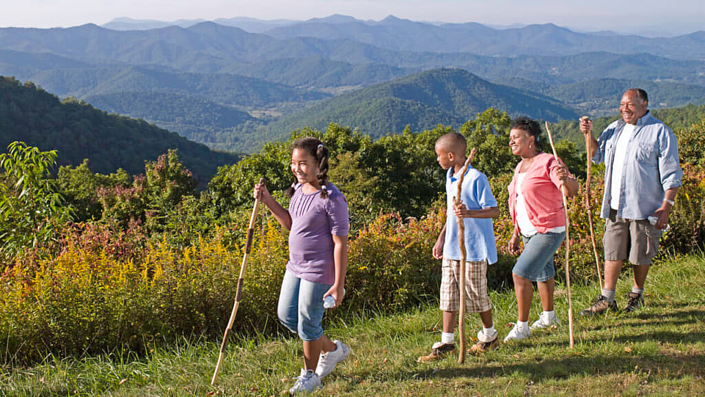 Family hiking with grand children (10-13) Blue Ridge Mountains in background