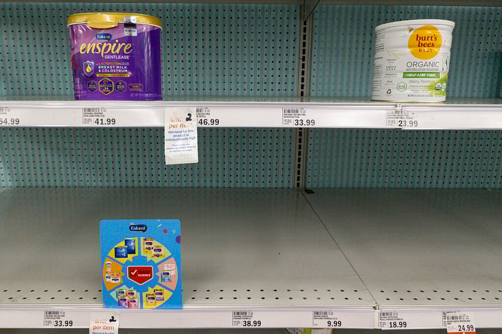 Baby formula is displayed on the shelves of a grocery store
