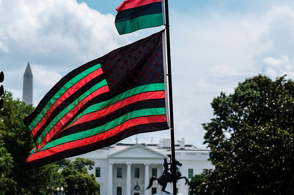 A Pan-African flag flies from Black Lives Matter Plaza
