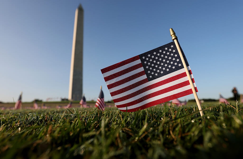 American flags at a COVID Memorial Project installation