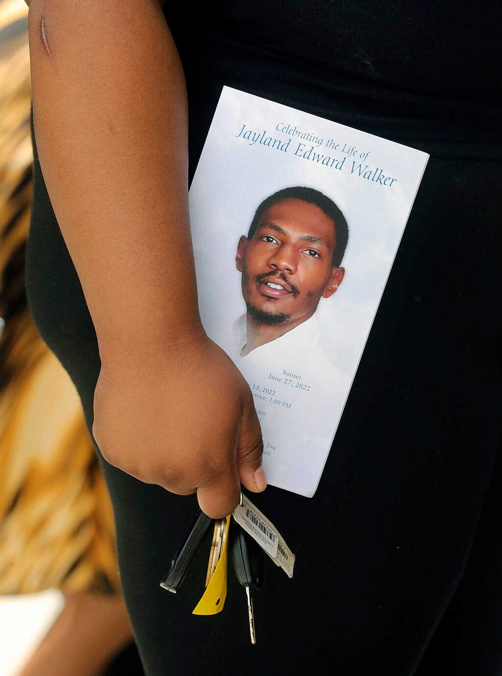 A person leaves the funeral of Jayland Walker