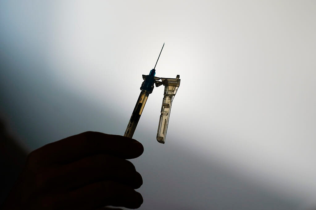 A syringe is prepared at a clinic