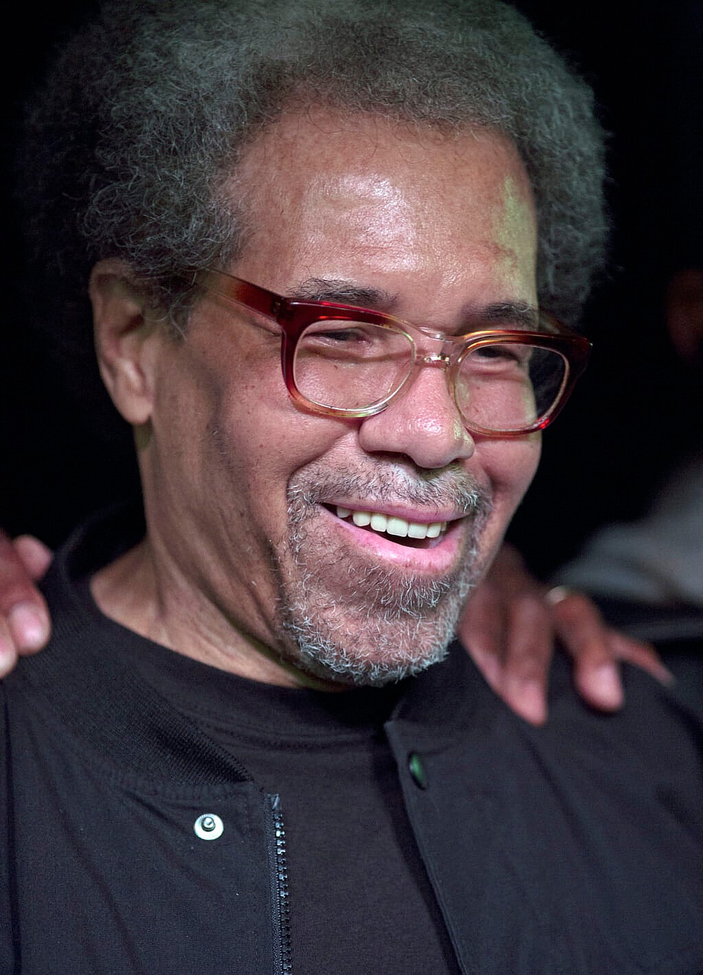 Former prisoner Albert Woodfox wearing a black shirt and jacket